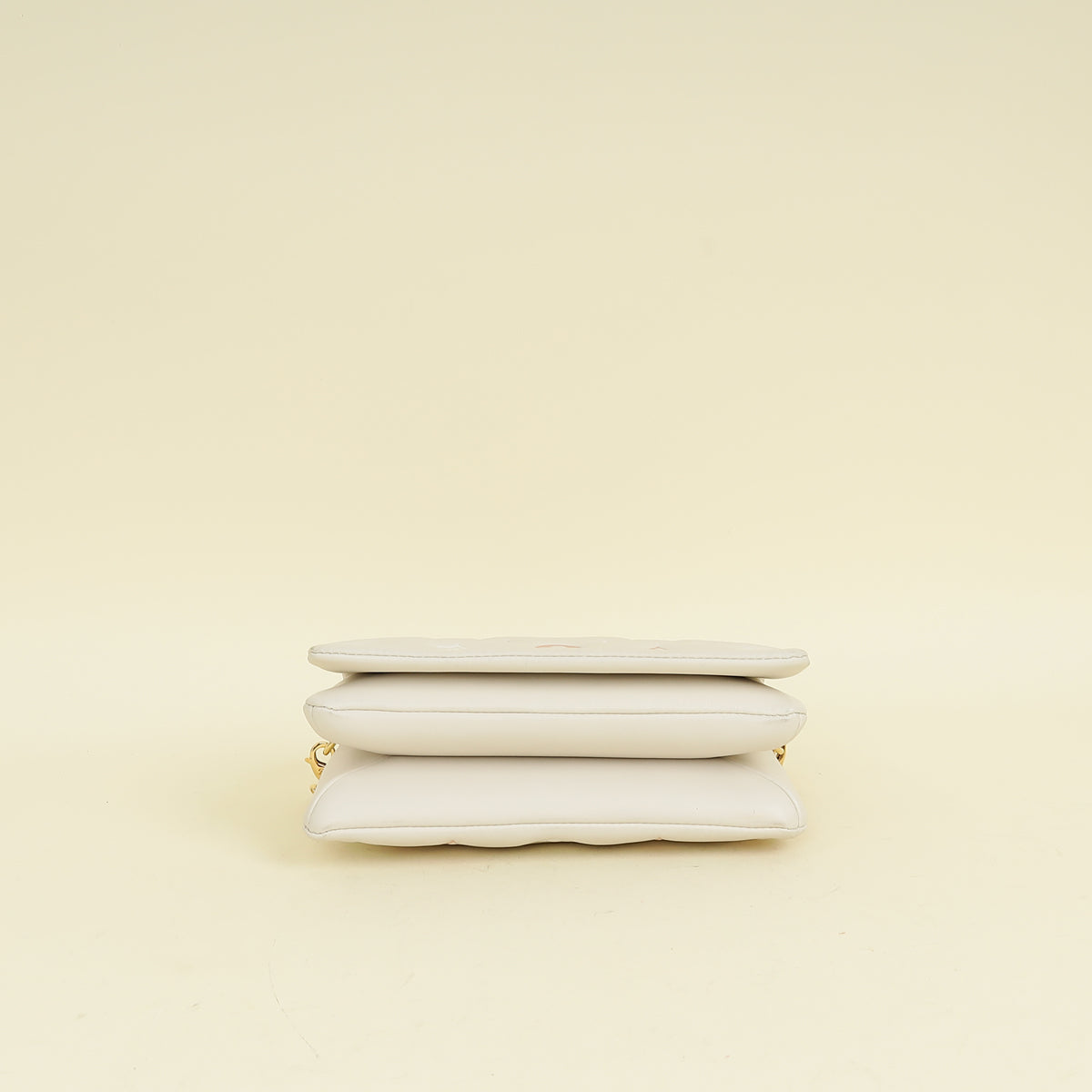 Louis Vuitton Creme Monogram-Embossed Pochette Coussin Bag