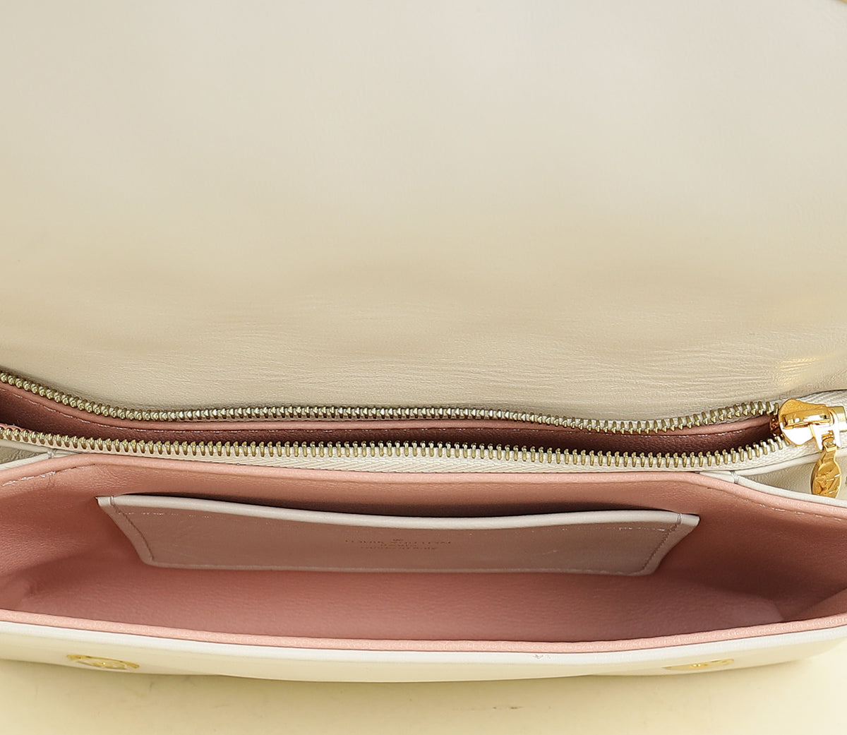 Louis Vuitton Creme Monogram-Embossed Pochette Coussin Bag