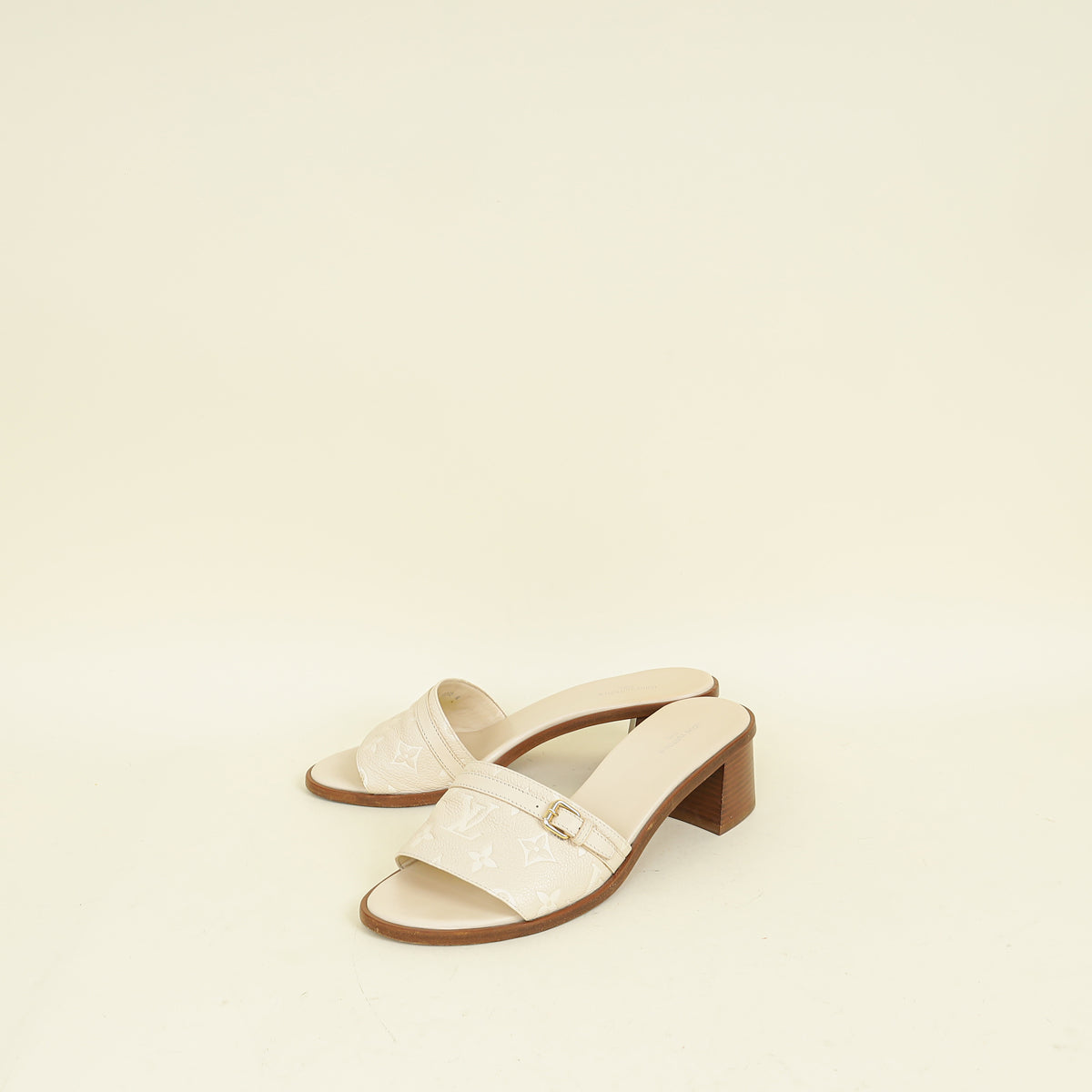 Louis Vuitton Cream Monogram Empreinte Lockit Mules 40