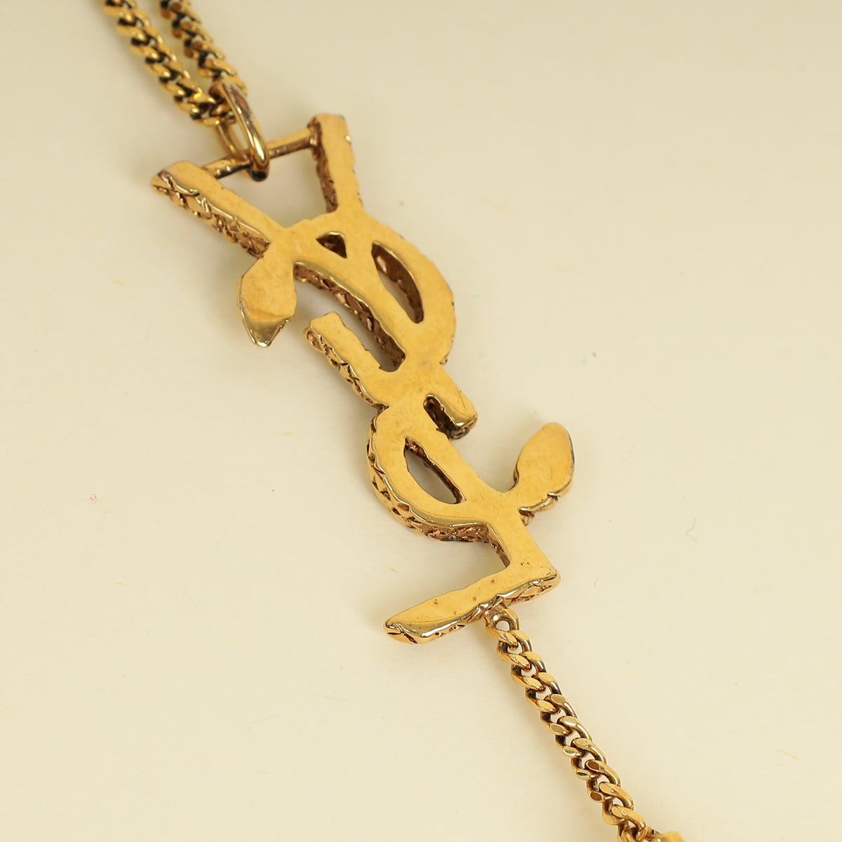 YSL Gold Brass Snake Monogram Tassel Pendant Necklace
