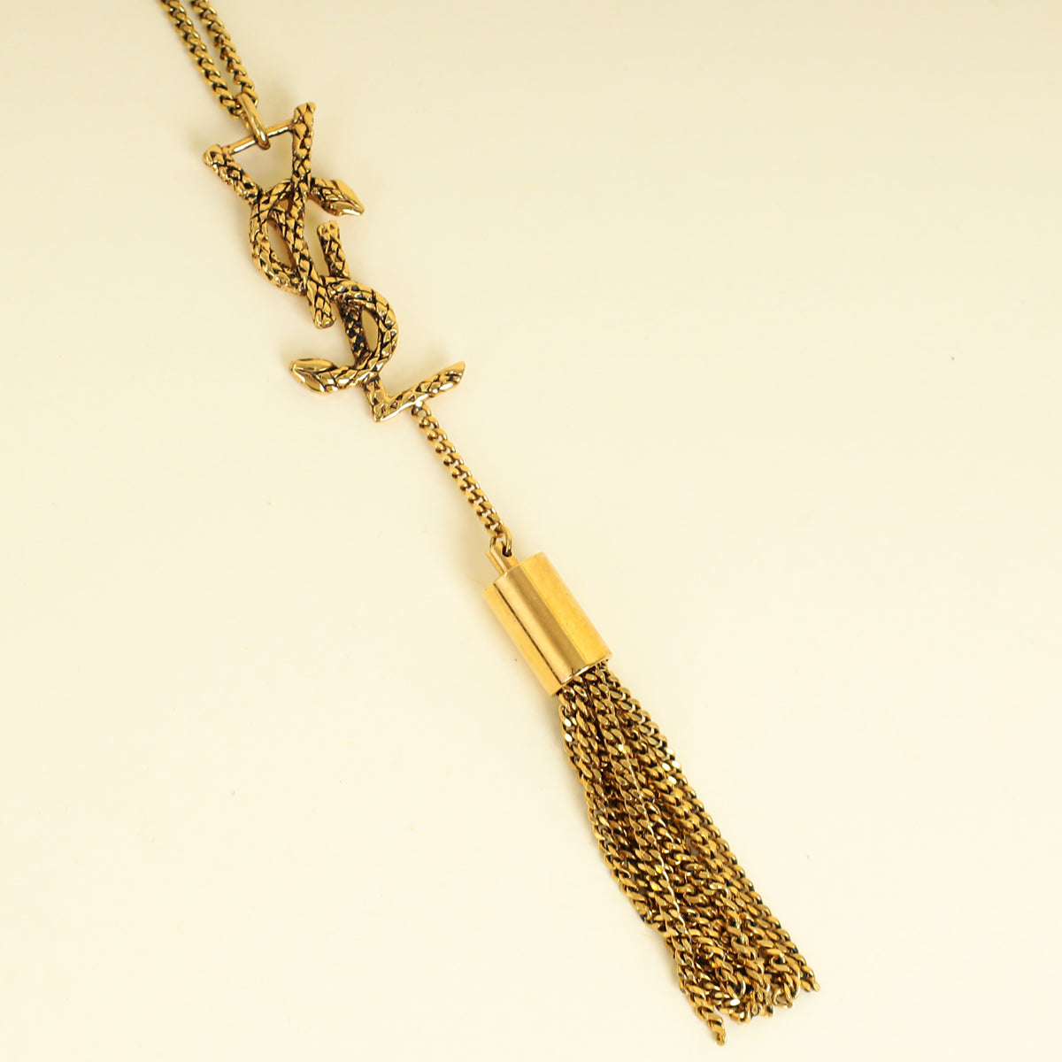 YSL Gold Brass Snake Monogram Tassel Pendant Necklace