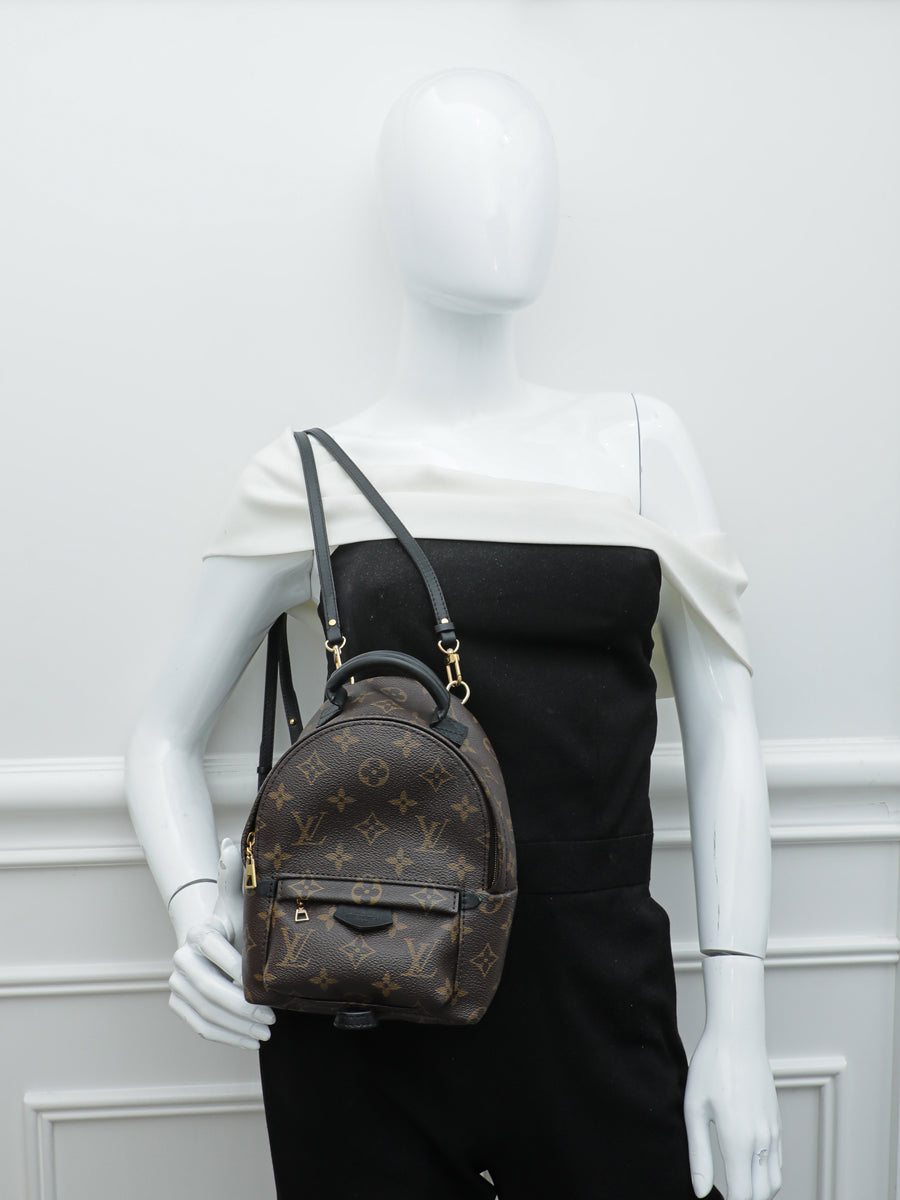 black mini lv backpack Steamer Leather This lightweight and versatile design is crafted from leather patterned with the houses signature monogram and is adorned with a removable coussin chain Louis Vuitton Palm Springs Infrarouge
